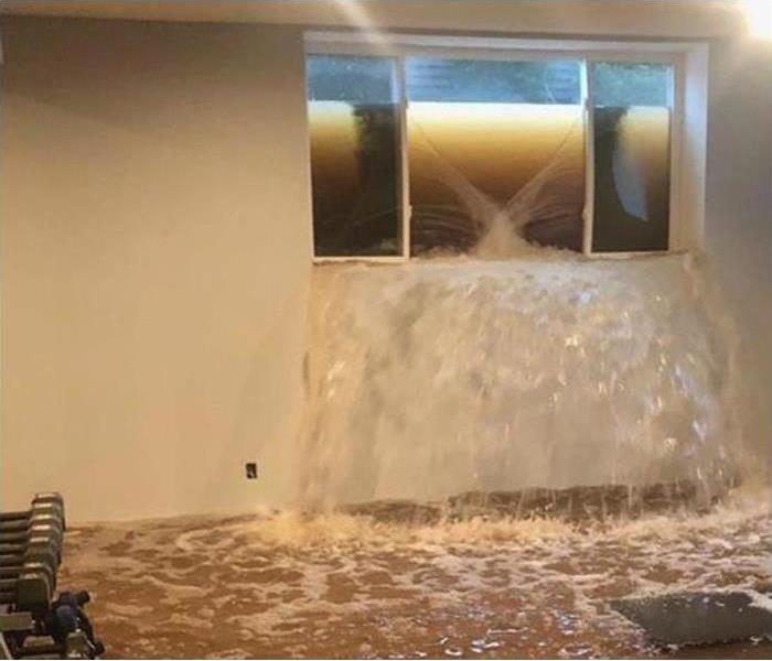 Water pouring in from basement window